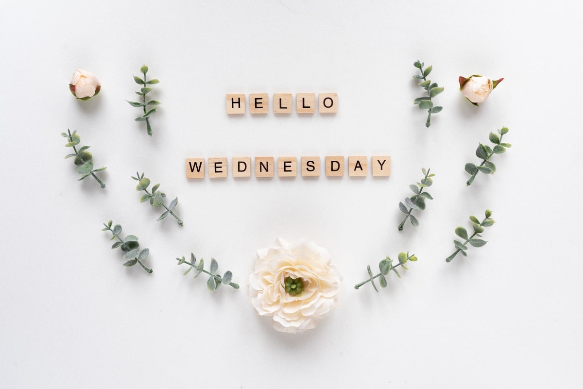 Hello Wednesday words on white marble background